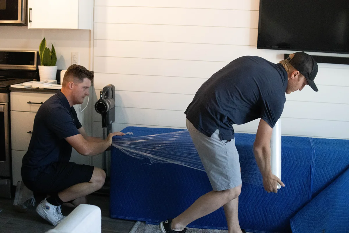 Utah's Moving & Storage mover wrapping furniture for safe transport