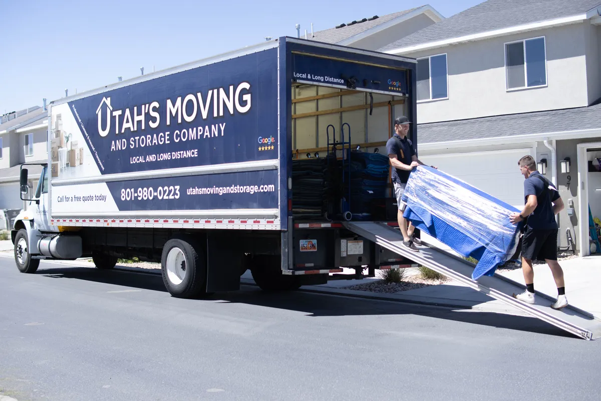 Utah's Moving & Storage crew loading furniture into the branded truck